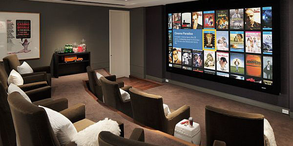 Media room with multiple seating and a large tv screen